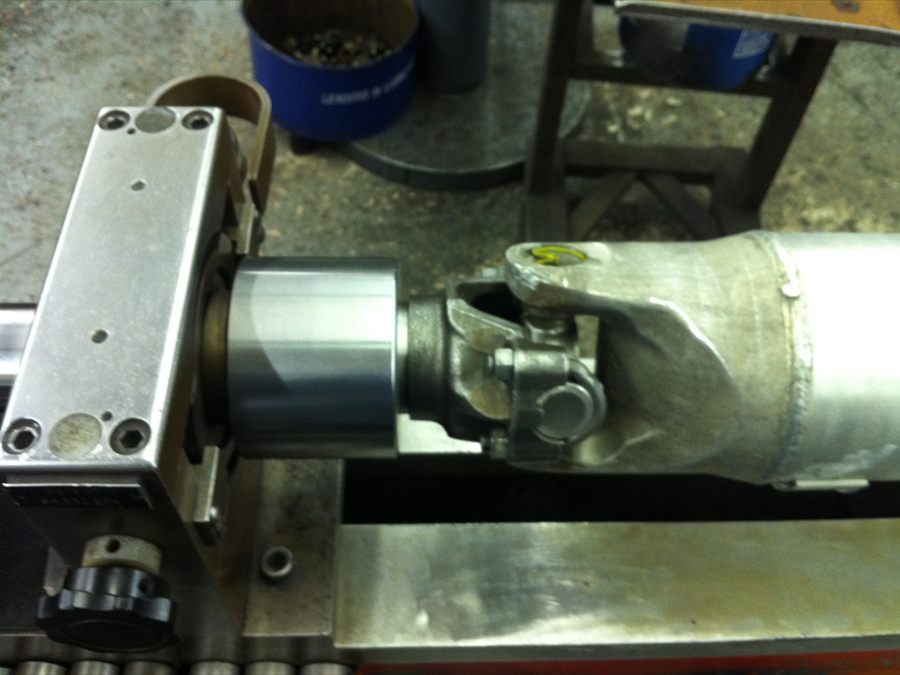 A drive shaft set up on the balancing machine at Driveline & Gear Service